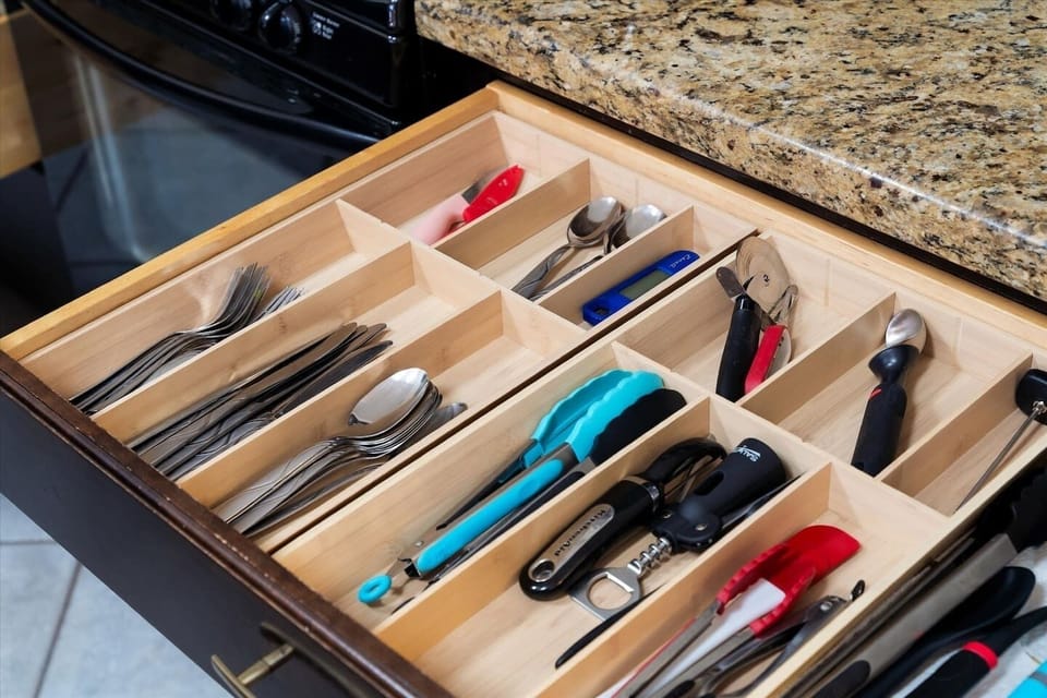 Well-stocked kitchen drawers with cooking utensils, cutlery, and essential tools. Thoughtfully organized to make meal prep easy and stress-free for families, groups, and longer stays.