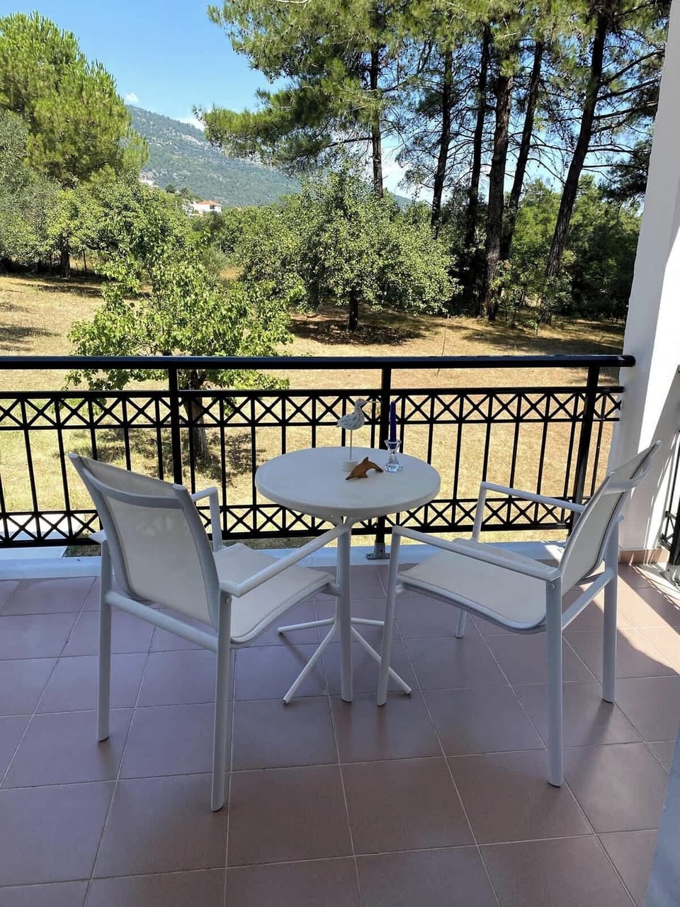 Sip your coffee in the cool shade of pine trees 