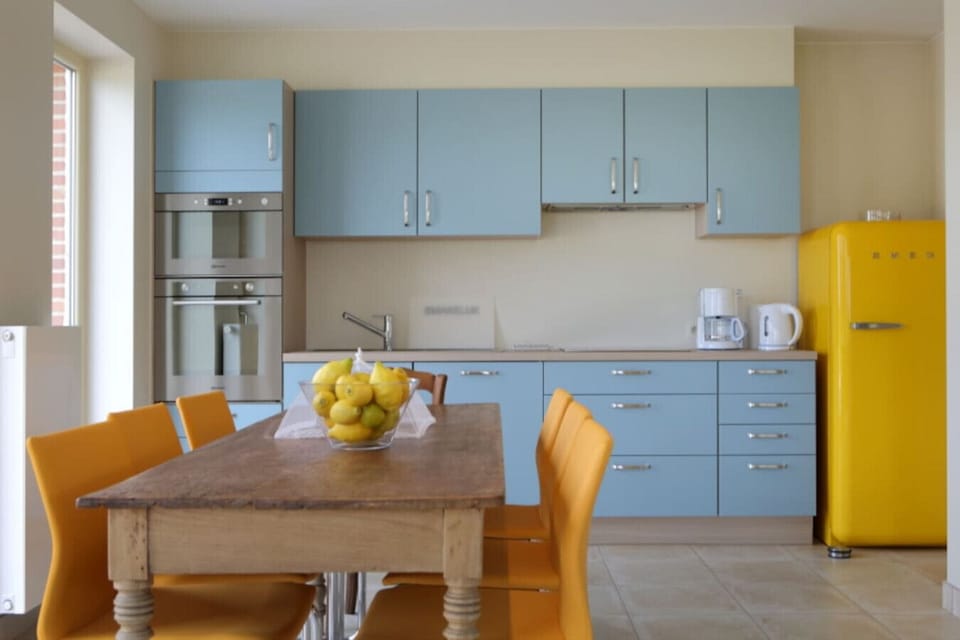 Kitchen with dinner table and dining area