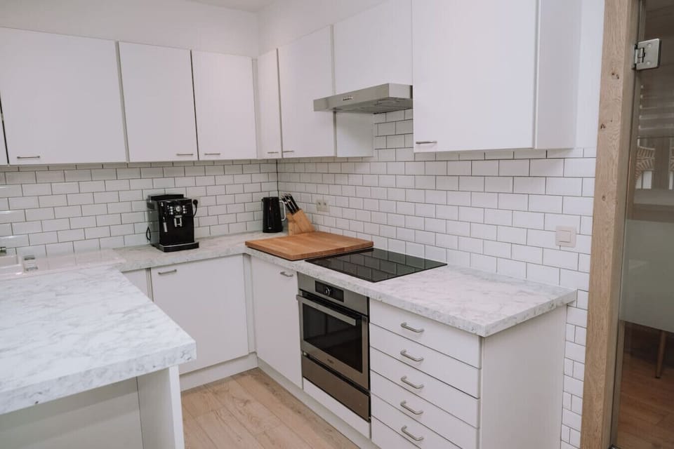 Kitchen with hair chairs and modern facilities