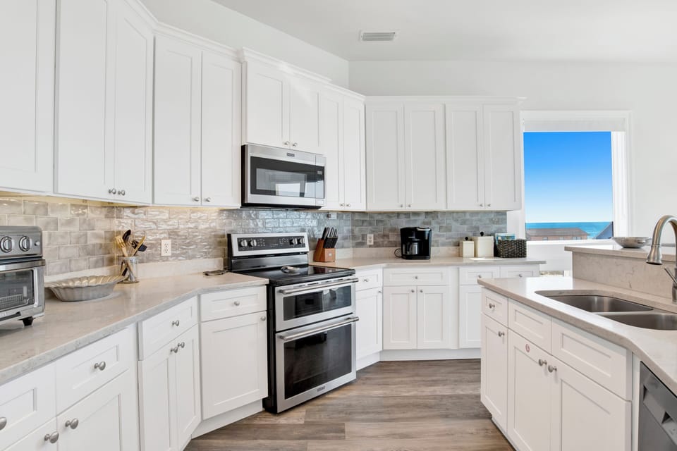 Stone counters and stainless appliances throughout