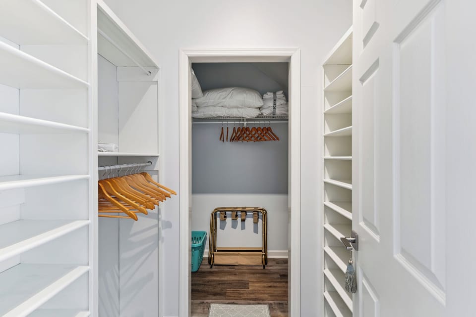 Primary walk in closet with plenty of space for your belongings