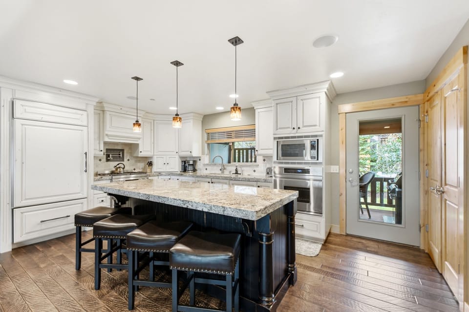 Enjoy morning coffee or evening drinks at the kitchen island with seating for four.