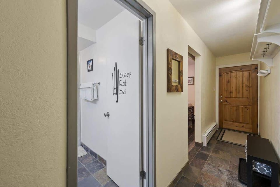 Unit entry hallway & bathroom entrance.