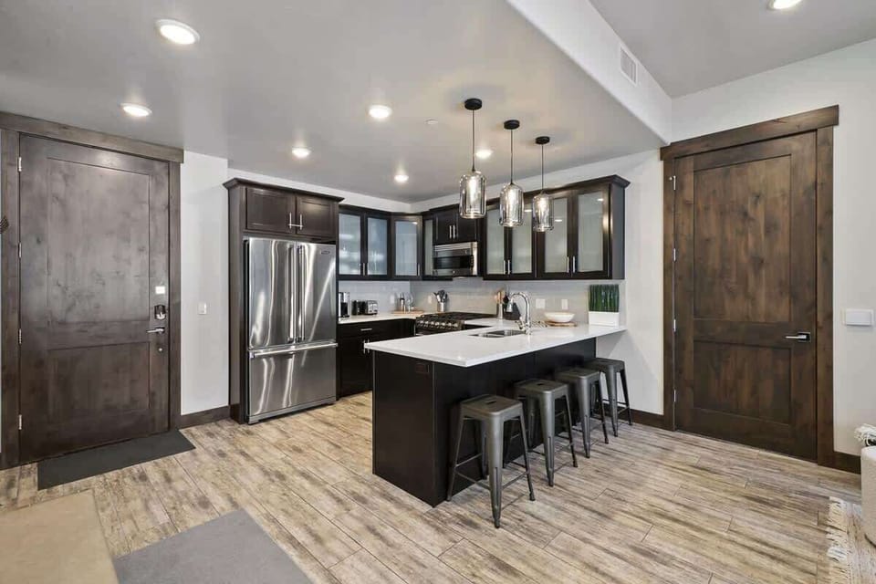 The kitchen is adjacent to the front entrance to the home.