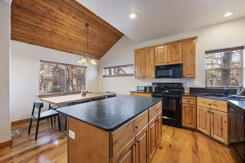 Kitchen & dining area next to living room space
