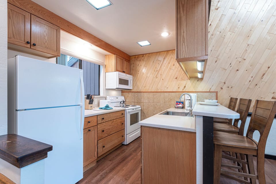 Cook together in the bright, fully equipped kitchen with bar seating.