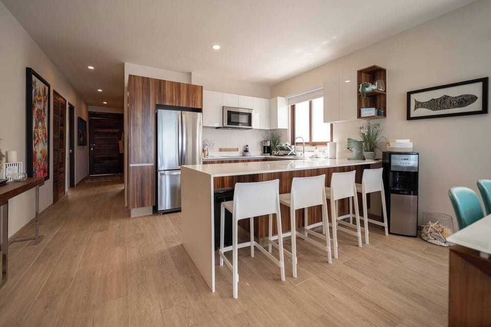 Whip up delicious meals in this fully equipped kitchen, then gather around the island for a casual bite or lively conversations.