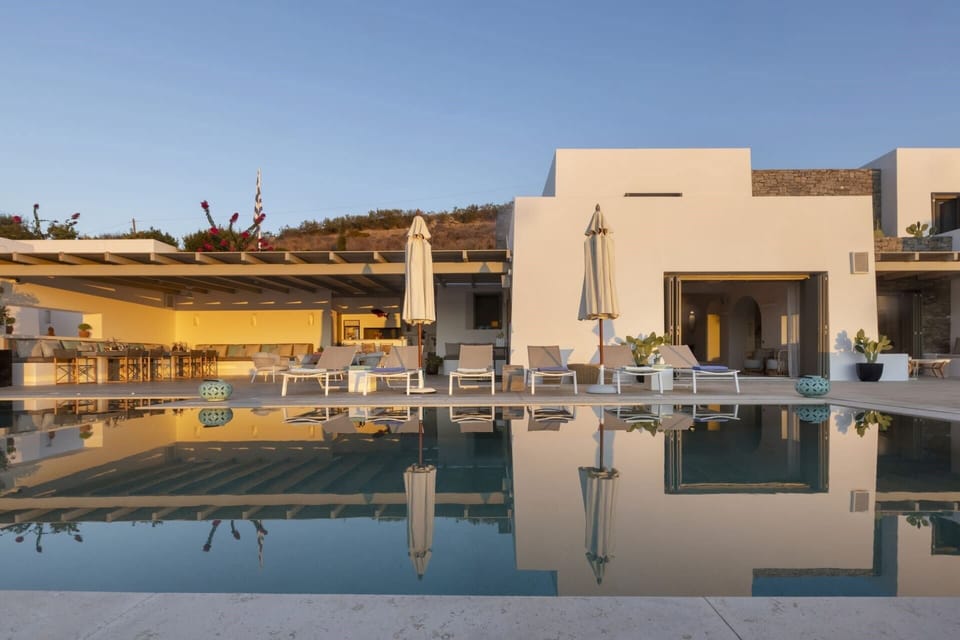 Palmyra's graceful façade reflected in the pool.