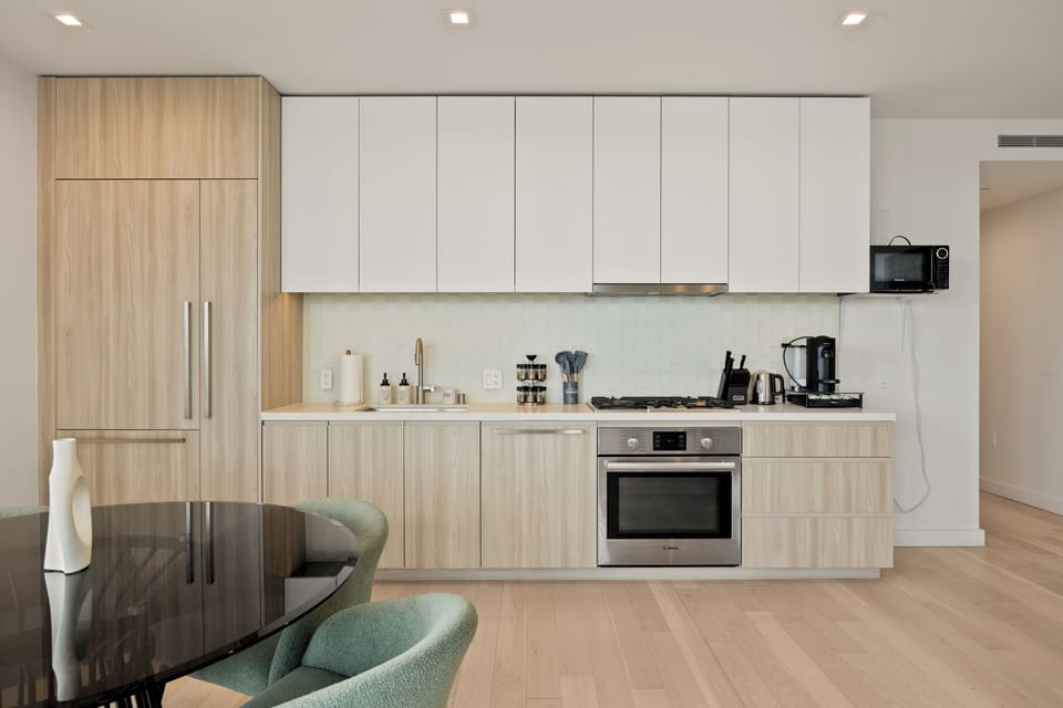 Sleek, handle-less cabinetry keeps the space clean and uncluttered.