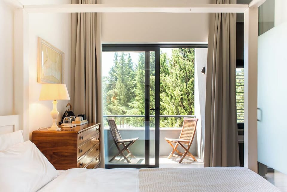 Wake up to forest views and sip coffee by the doors.