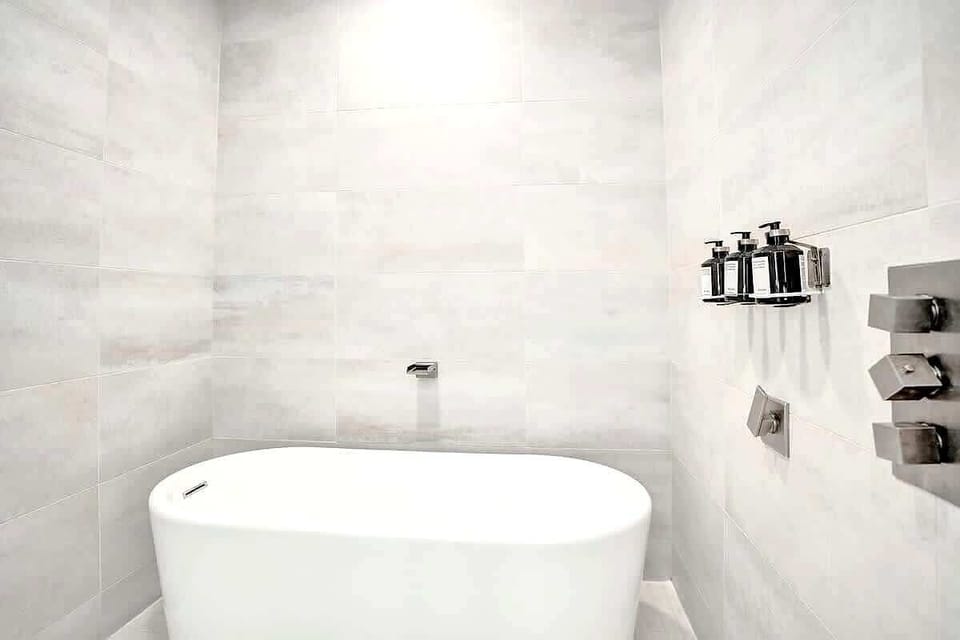 Freestanding soaking tub in master bathroom