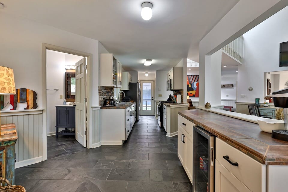 Slate floors and a dedicated beverage cooler. Durable, practical, and ready for entertaining.