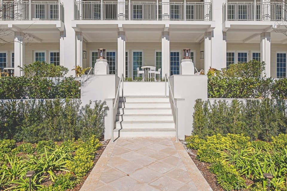 Arrive in style to pristine grounds and breezy beachfront charm.