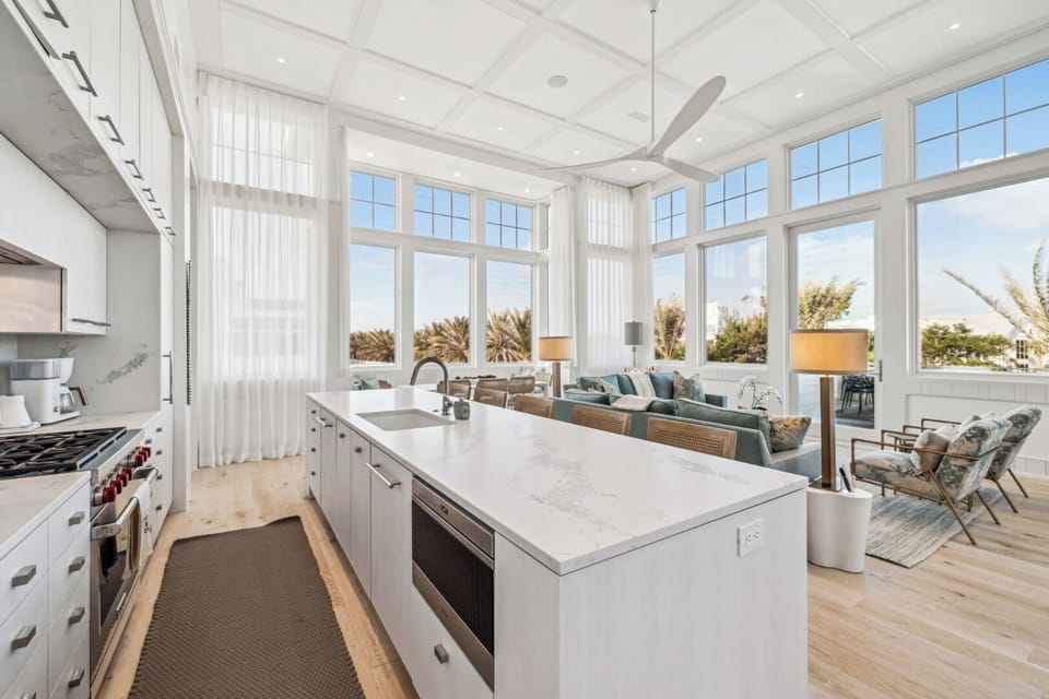 Cook and connect around a sleek island in bright elegance.