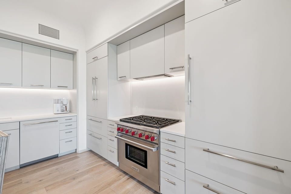 Gather and prep easily with generous counters and bright cabinetry.