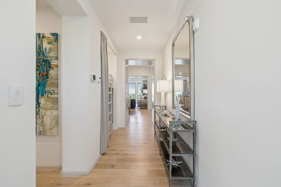 Arrive with ease through a bright, airy entry corridor.