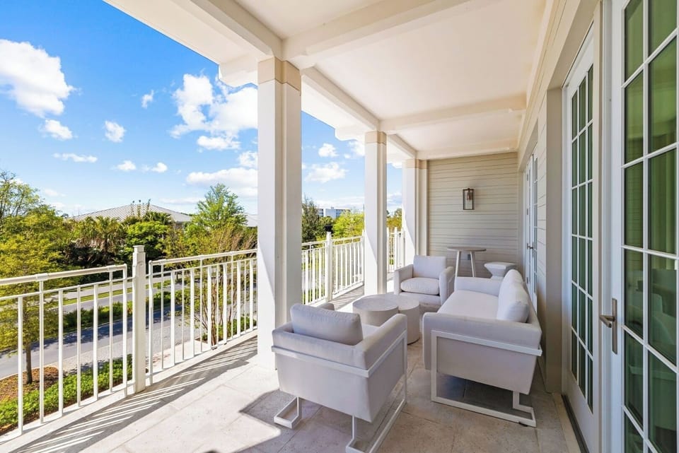 Sip morning coffee on the breezy balcony with open views.
