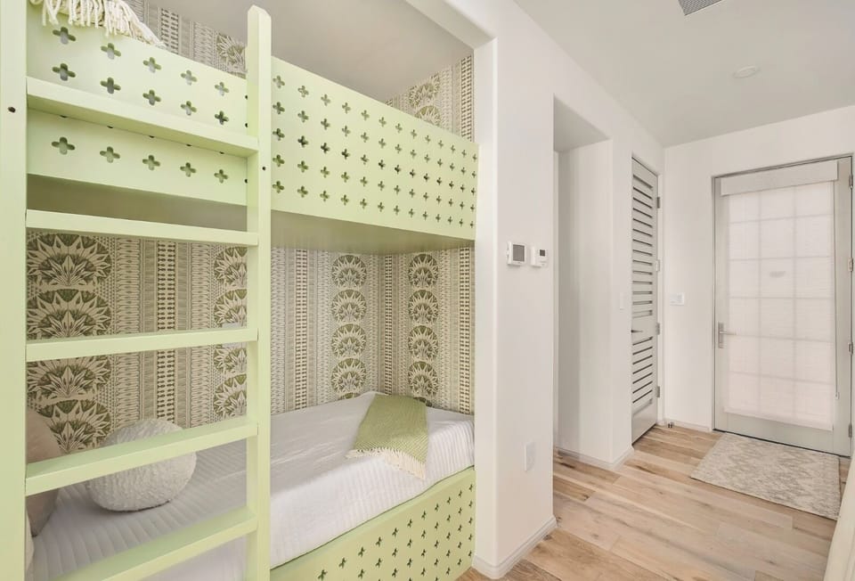 Drift off in cozy built-in bunks with playful design.