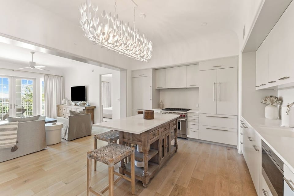 Sip coffee as the bright kitchen opens to living spaces.