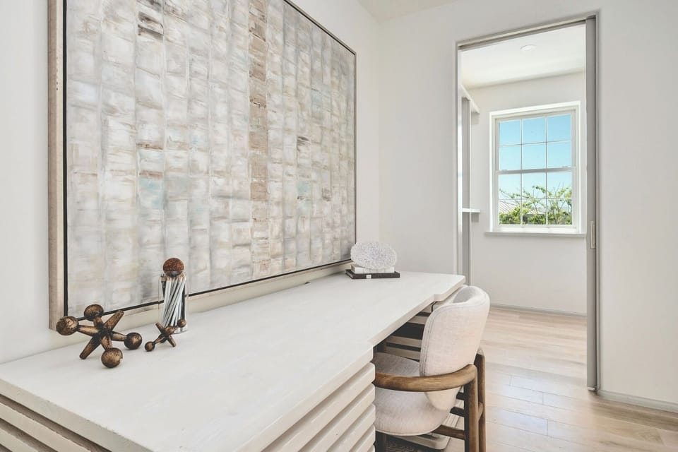Settle in and focus at a calm, light-filled workspace.
