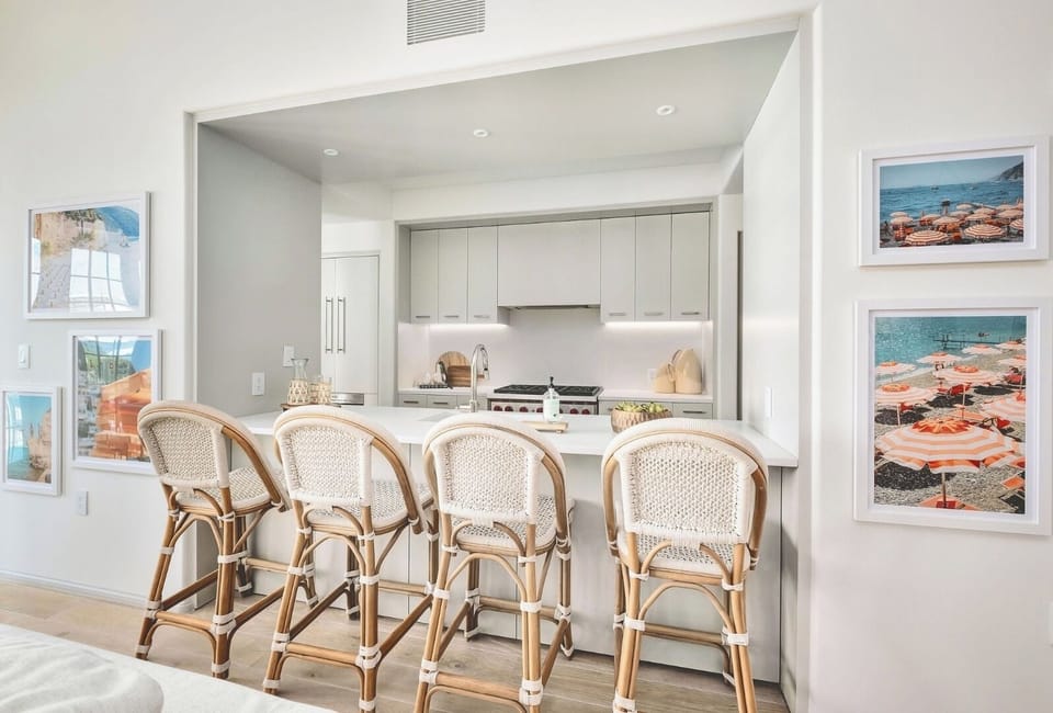 Sip coffee at the island bar in a sleek kitchen.