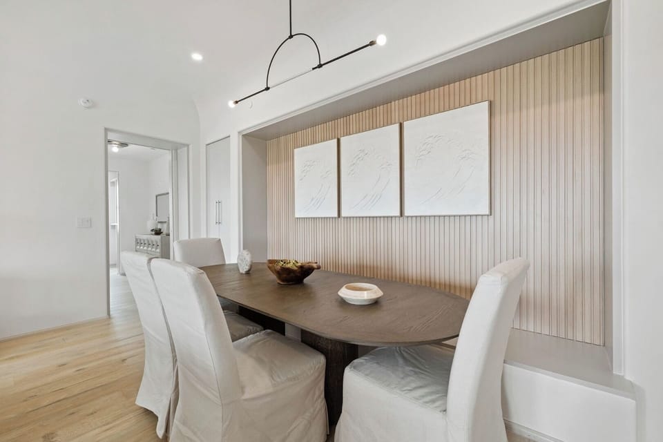 Linger over dinner in the stylish dining nook under modern lighting.