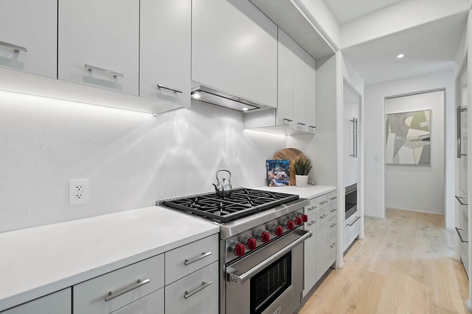 Cook with ease on the chef-grade range and bright counters.