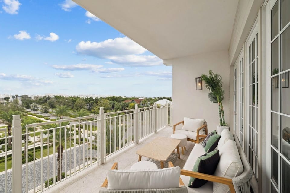 Unwind on the breezy balcony with cushioned seating and views.