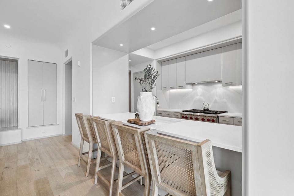 Serve casual bites at the spacious island with bar seating.