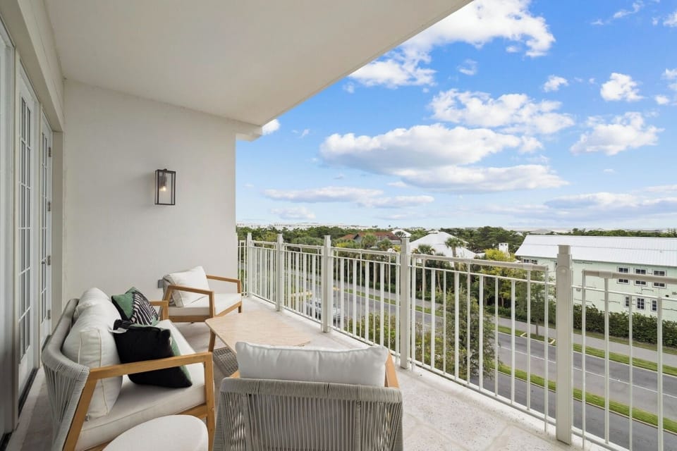 Sip morning coffee outdoors while clouds drift over the skyline.