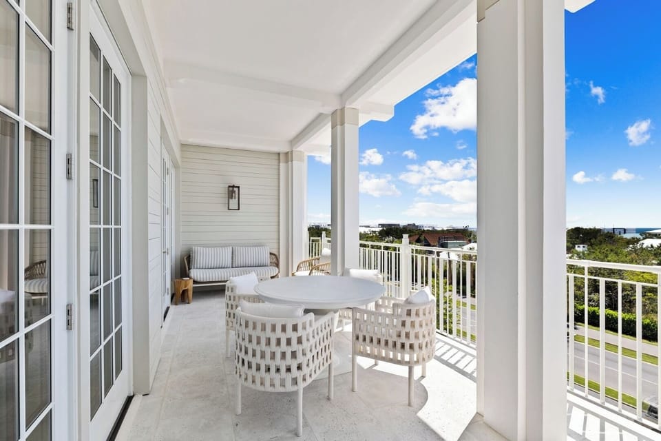 Sip coffee on the covered balcony with open-sky views.