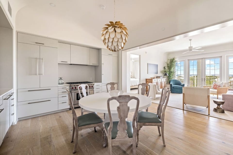 Cook together in the sleek kitchen beside a bright dining nook.