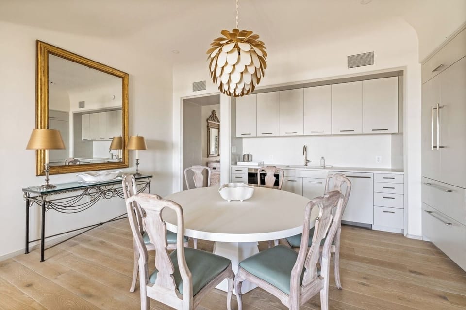 Share long dinners under statement lighting in a calm setting.