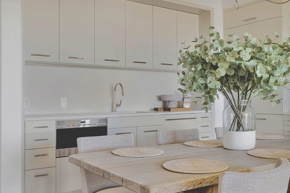 Gather for easy meals in the sleek, light-filled kitchen.