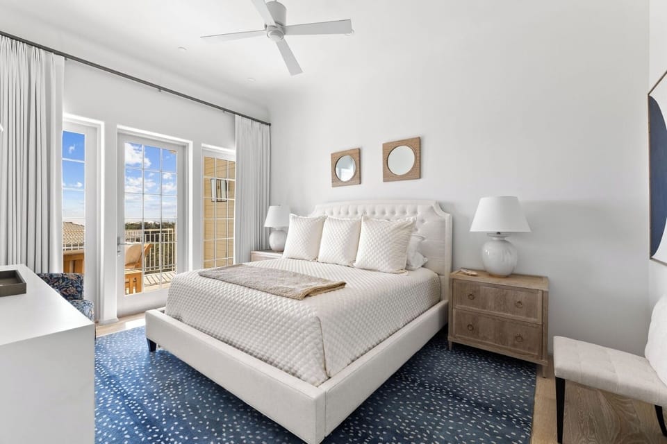 Drift into serene sleep in a bright, balcony-access bedroom.