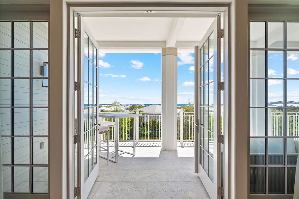 Step through French doors to morning coffee in salty air