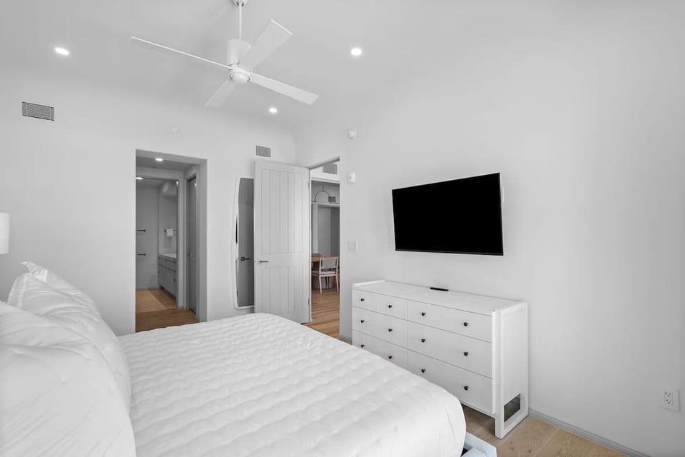 Settle in for movie nights from bed with wall TV.