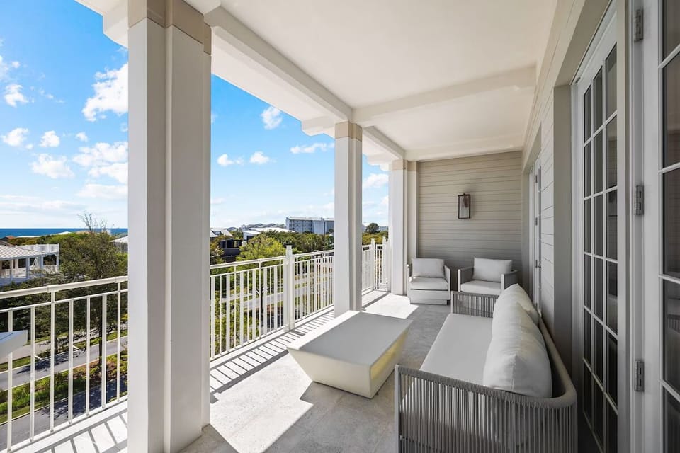 Unwind on the breezy balcony with plush seating and views