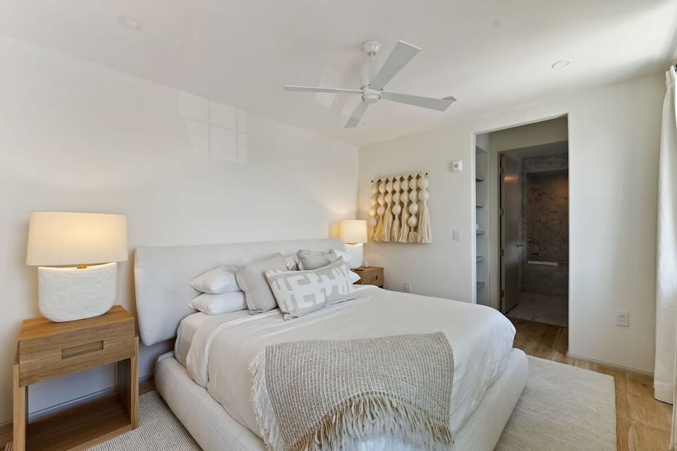 Sink into a calm, cloud-soft bed after beach days