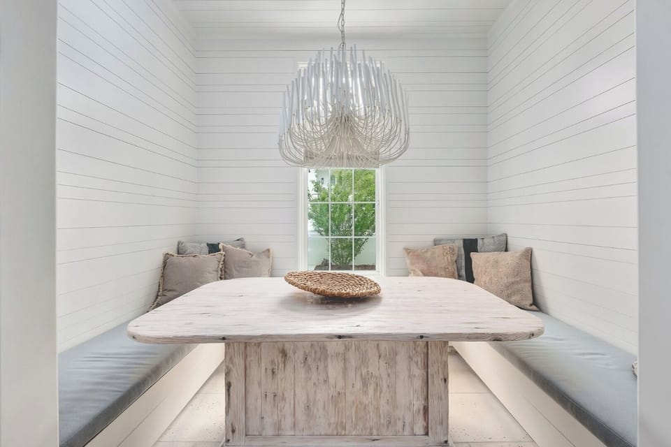 Linger over long meals in a chic banquette breakfast nook.