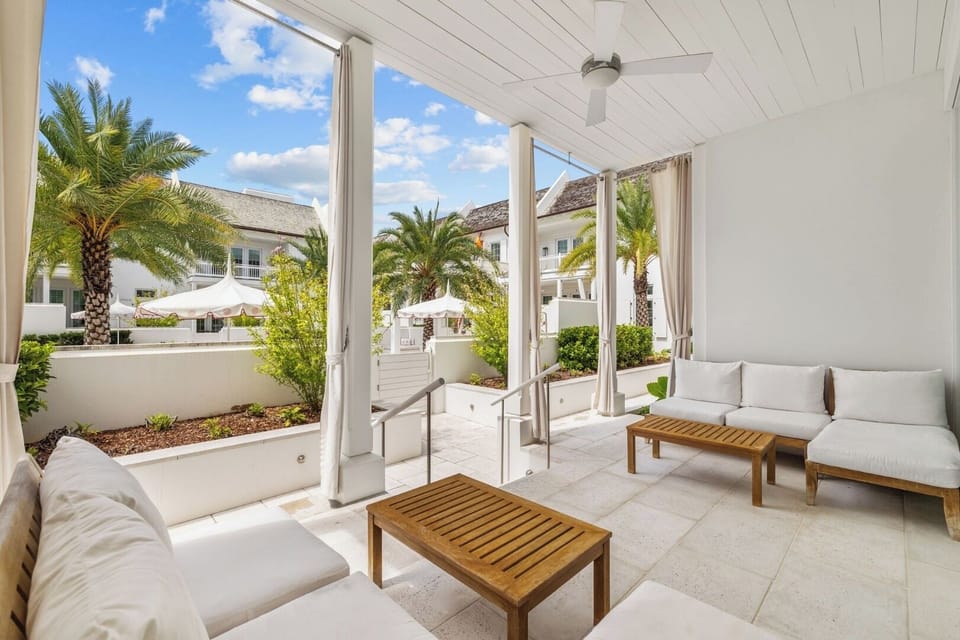 Lounge outdoors under the covered patio with breezy shade.