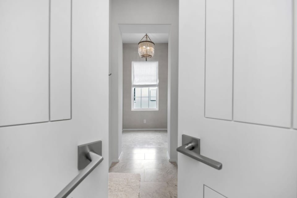 Step inside to serene, minimalist hallways with soft natural light.