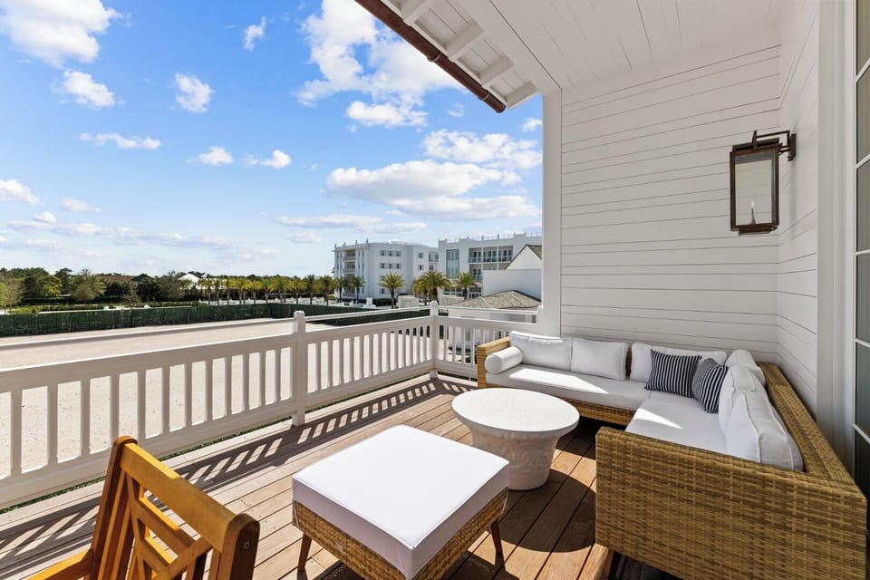Sip morning coffee on the sunny balcony lounge seating.