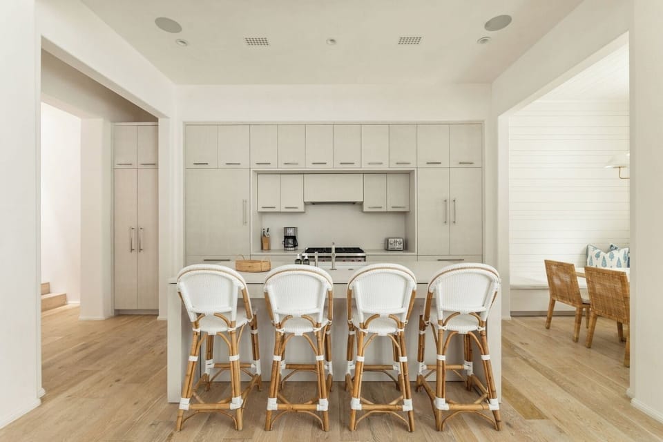 Entertain effortlessly with bar seating and a spotless, modern kitchen.