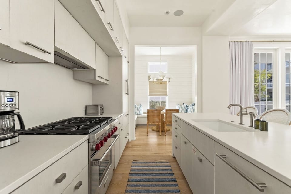 Cook with ease in a sleek chef’s kitchen with generous island.