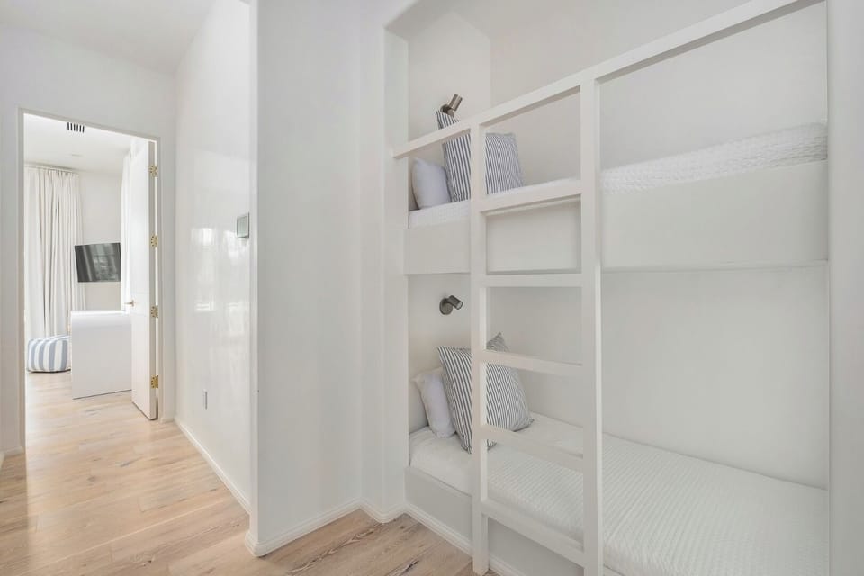 Settle in with charming bunks and a quiet hallway nook.
