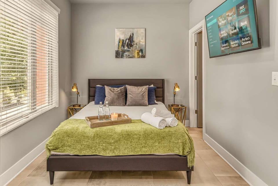 A ground-floor queen bedroom with its own TV and warm-toned tiles works perfectly for anyone who'd rather avoid stairs during a longer stay
