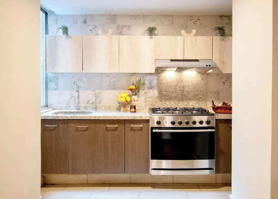 Fully equipped kitchen with modern appliances and ample counter space, perfect for preparing everything from quick breakfasts to full home-cooked meals.