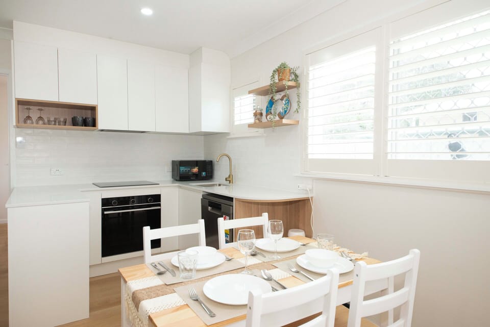 Dining space for four that flows naturally into the open-plan layout.